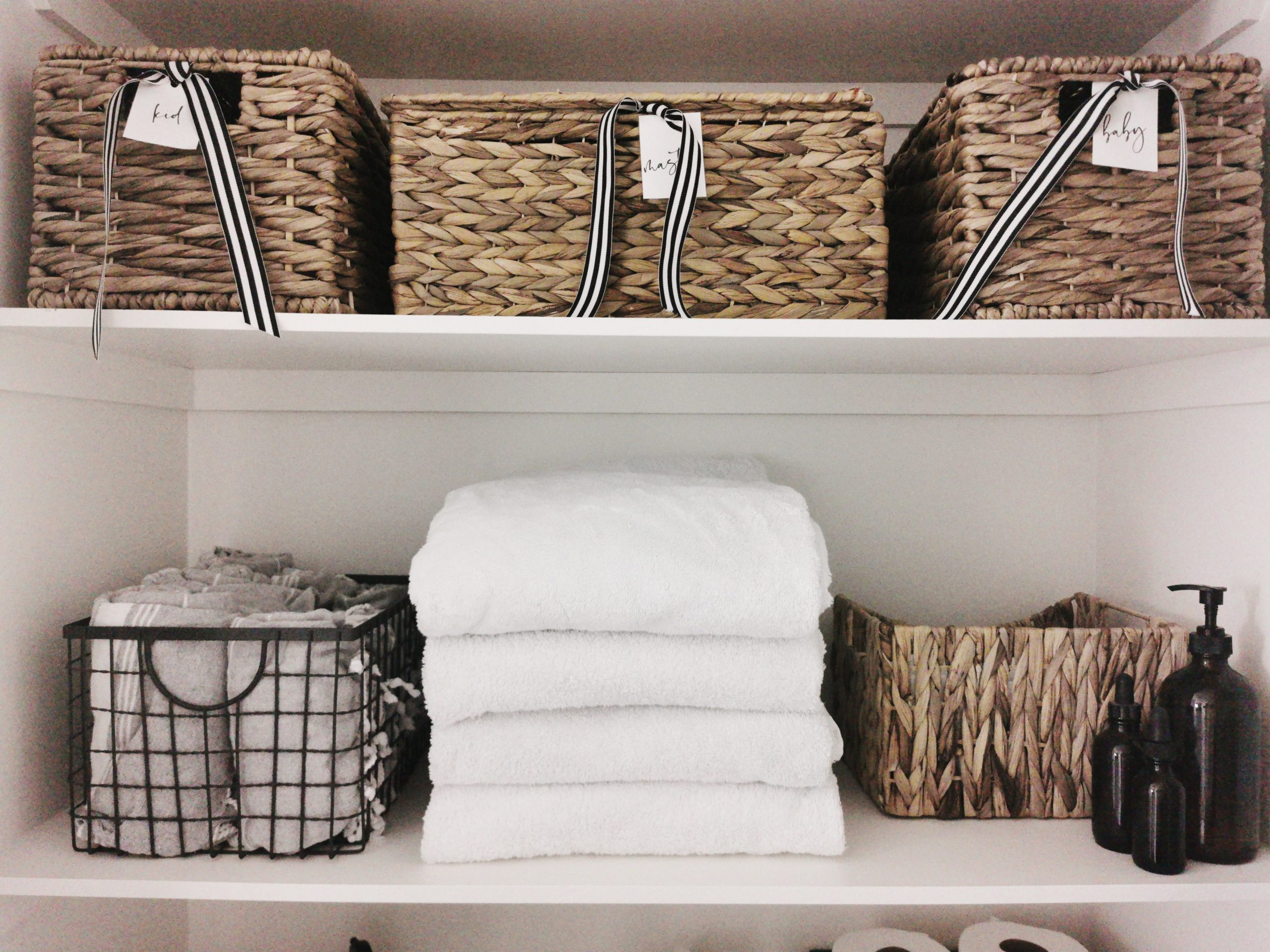 Linen Closet Organization with Baskets: A simple way to eliminate visual  clutter